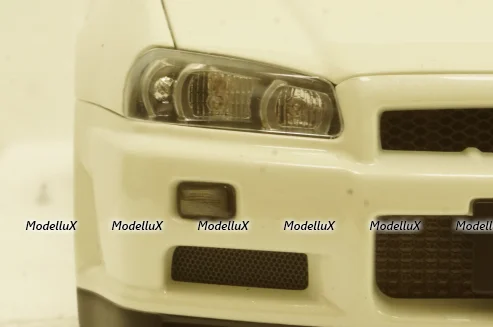 Nissan Skyline GT-R (R34) V-Spec II, white pearl, 77406,AutoArt 1:18 Уценка