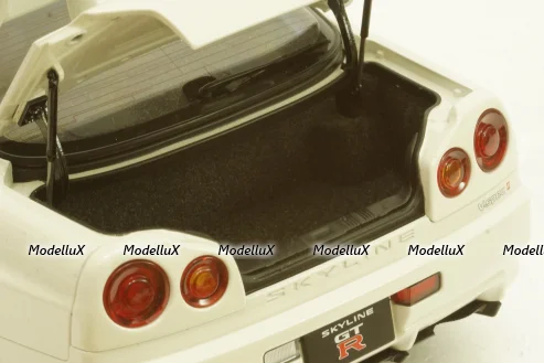 Nissan Skyline GT-R (R34) V-Spec II, white pearl, 77406,AutoArt 1:18 Уценка