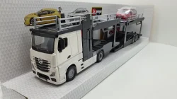 Mercedes Actros 2545 white Car transport with Ford Focus Turnier, Burago 1:43